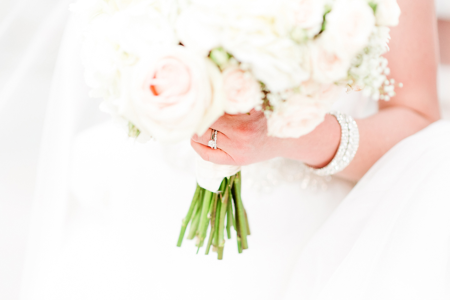 3 ways I love and serve my clients. Bride holds bouquet and shows off wedding ring and bracelet