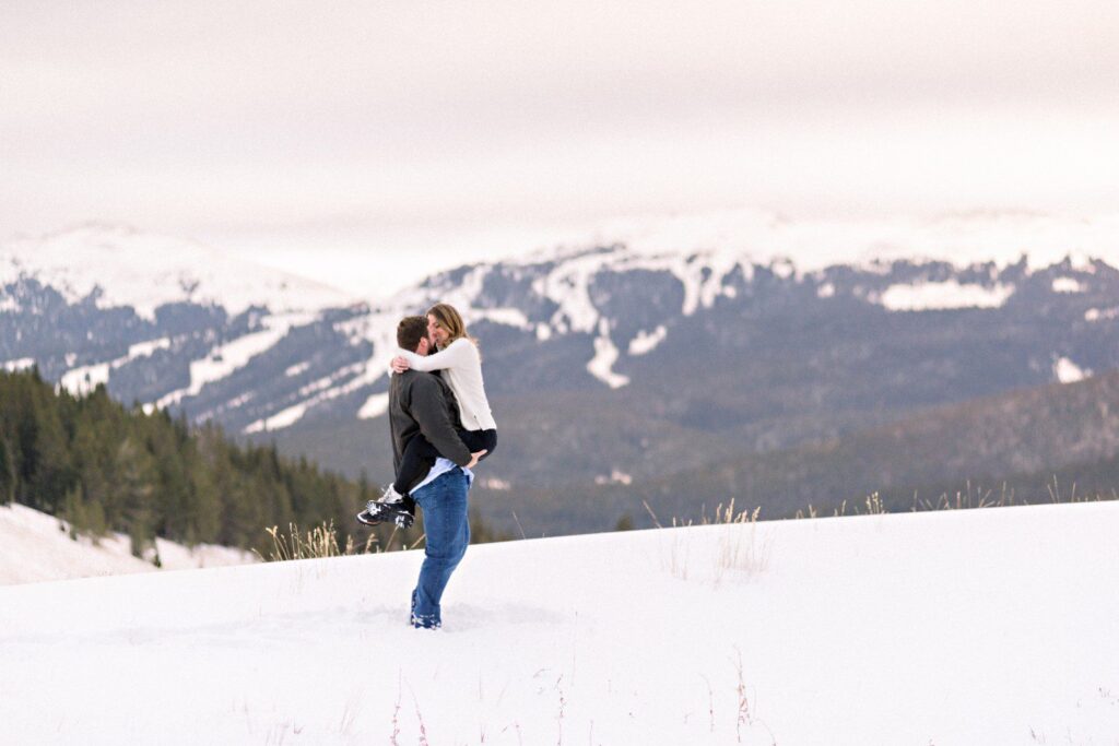 Snowy mountain top engagement session Vail Colorado