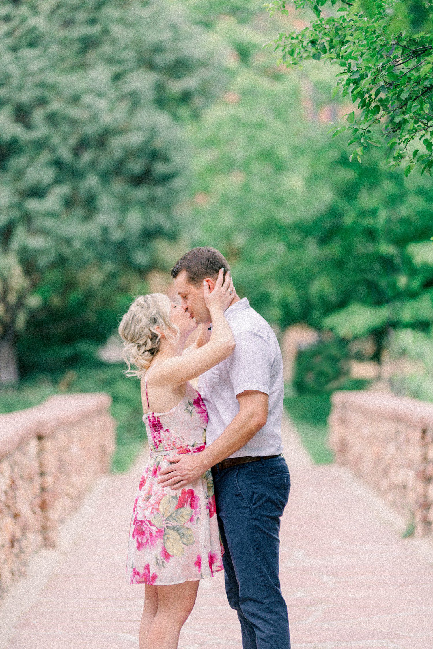 Couple kissing for engagement photos at CU Boulder 