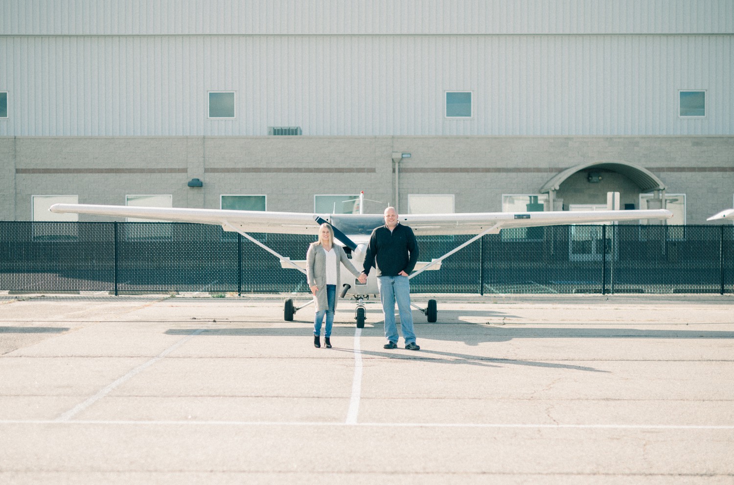 Engagement Photos in front of airplane in Denver.