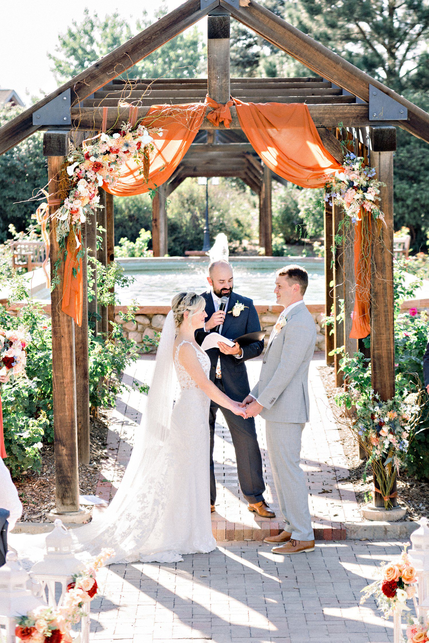 Wedding ceremony at Hudson Gardens in Denver.