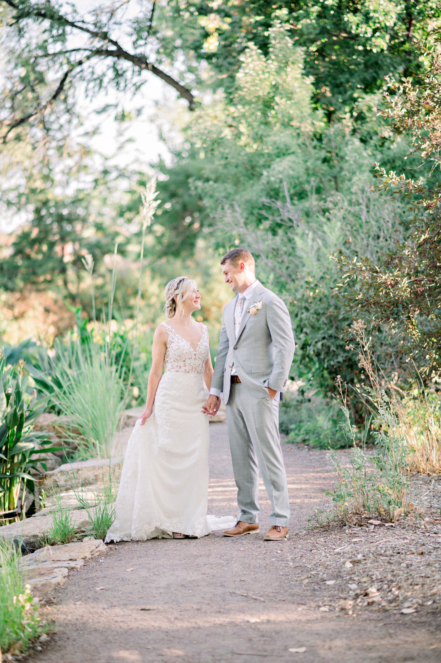 Photos of bride and groom walking in Hudson Gardens.