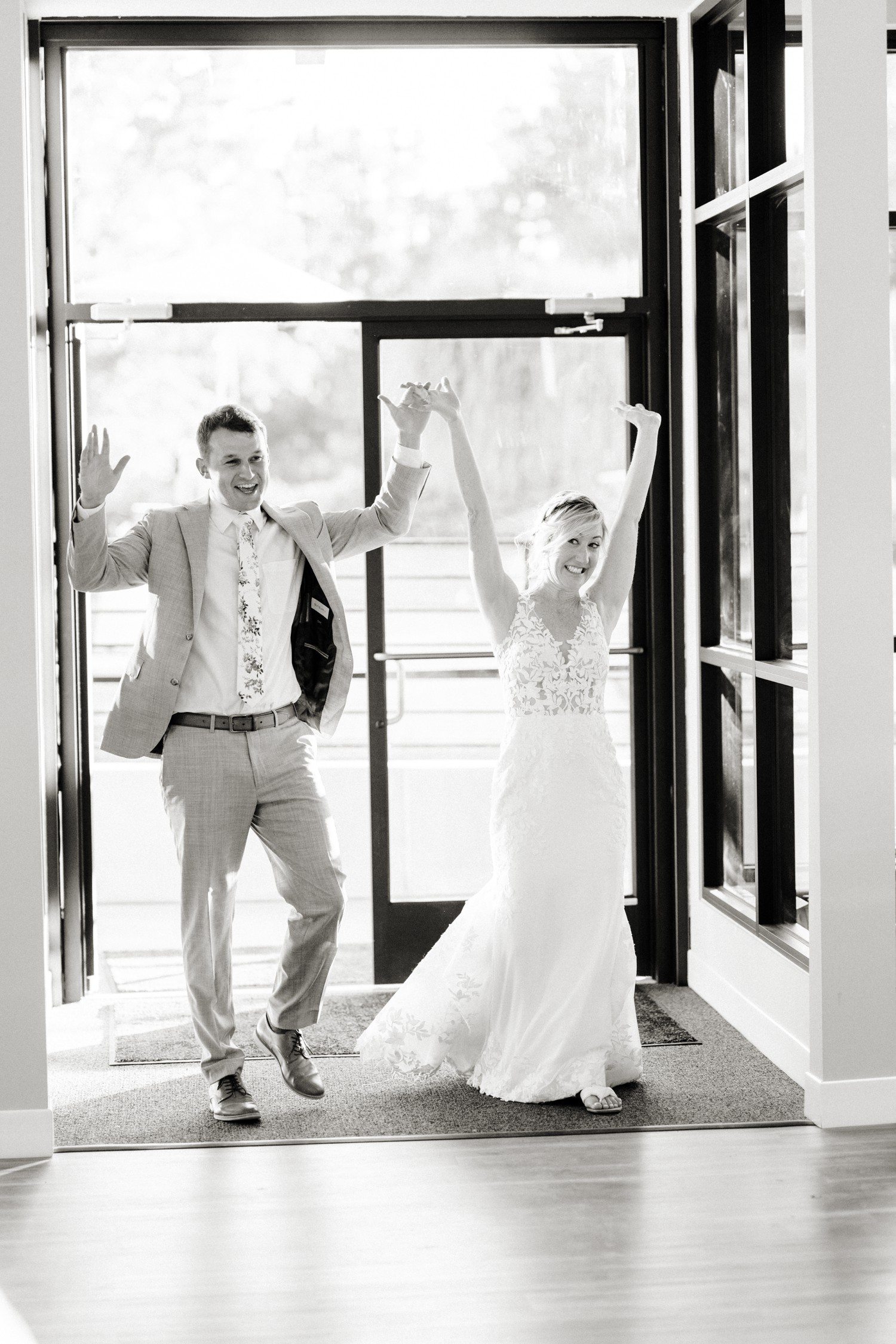 Bride and groom wedding reception entrance at Hudson Gardens.