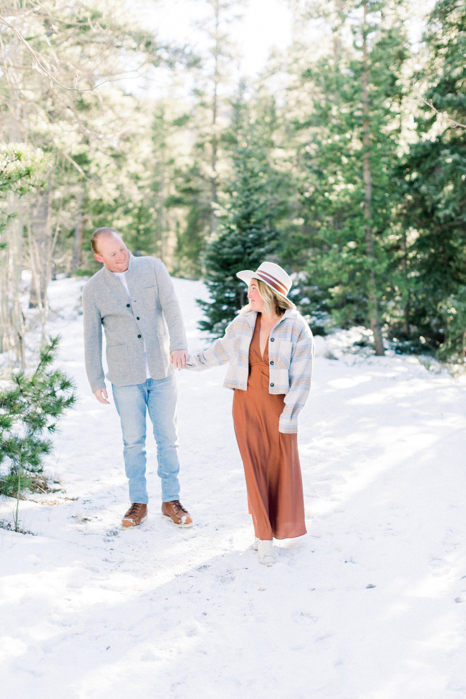 Couple walking during engagement session at Officer's Gulch.