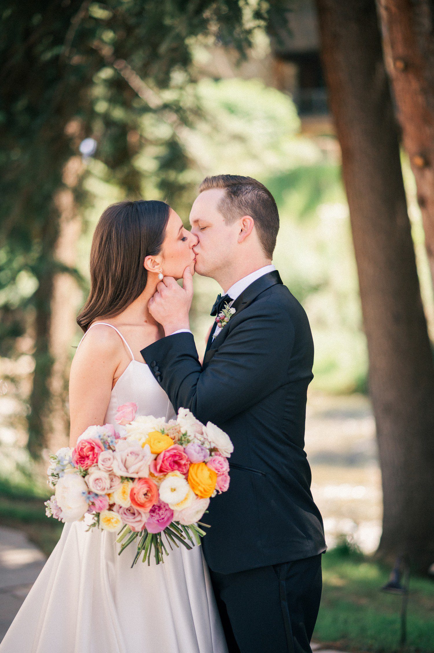 Bride and Groom kissing before wedding at The Arrabelle and Vail Chapel. 