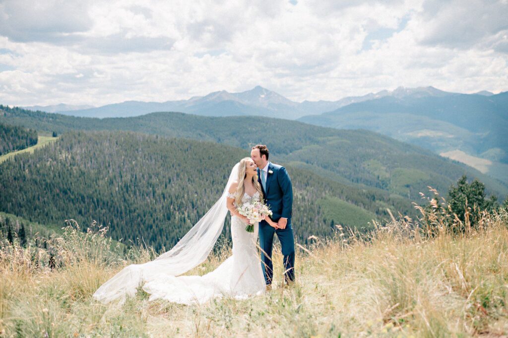 Wedding photos on Vail Mountain before wedding at Vail Chapel. 